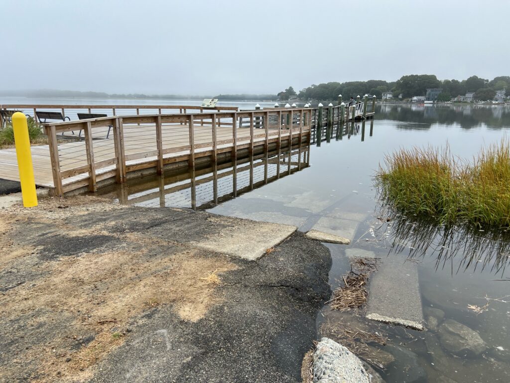 a wooden dock over a body of water (MyCoast AI)