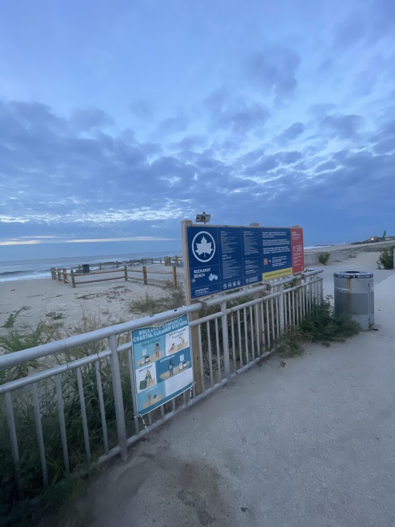 a sign on a fence (MyCoast AI)