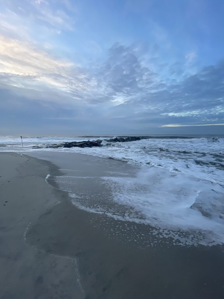 a beach with waves crashing on it (MyCoast AI)