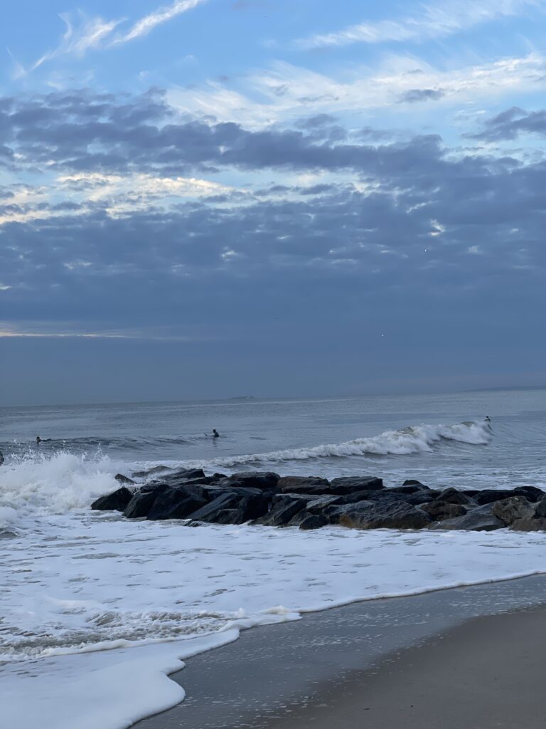 a beach with waves crashing on it (MyCoast AI)