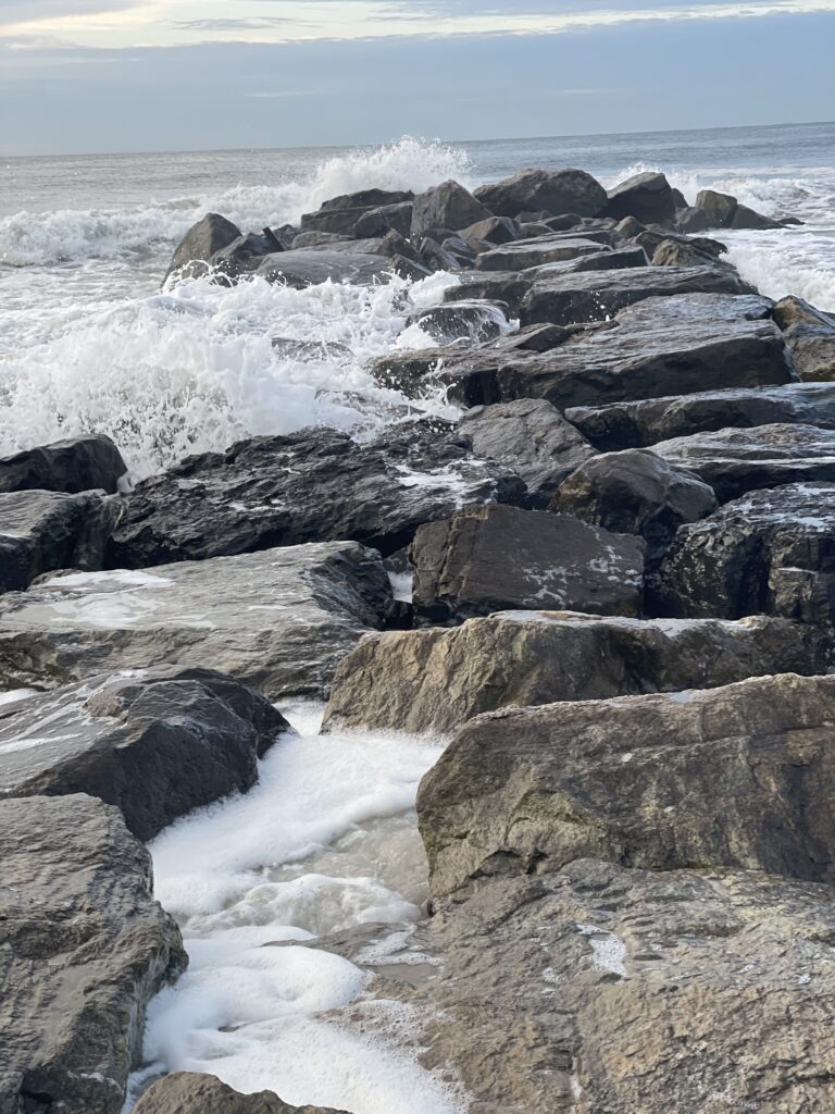 a rocky beach with waves crashing (MyCoast AI)