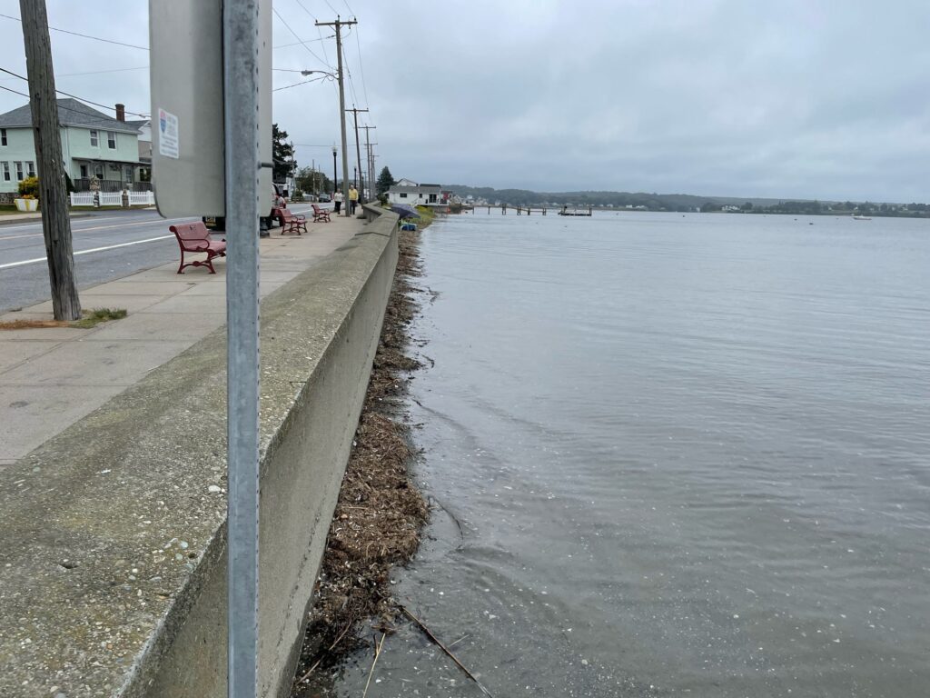 a sidewalk next to a body of water (MyCoast AI)