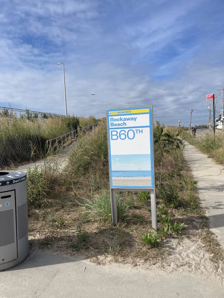 a sign on the side of a road (MyCoast AI)