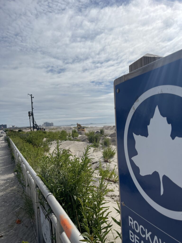 a sign on a fence (MyCoast AI)