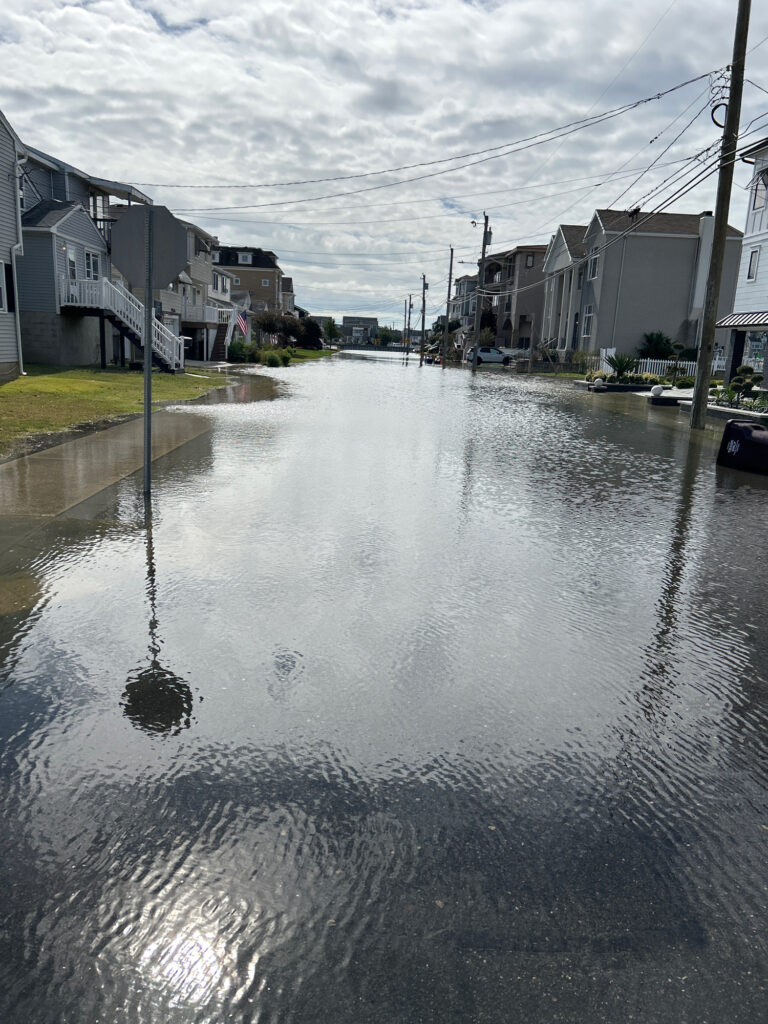 a flooded street with buildings on either side of it (MyCoast AI)