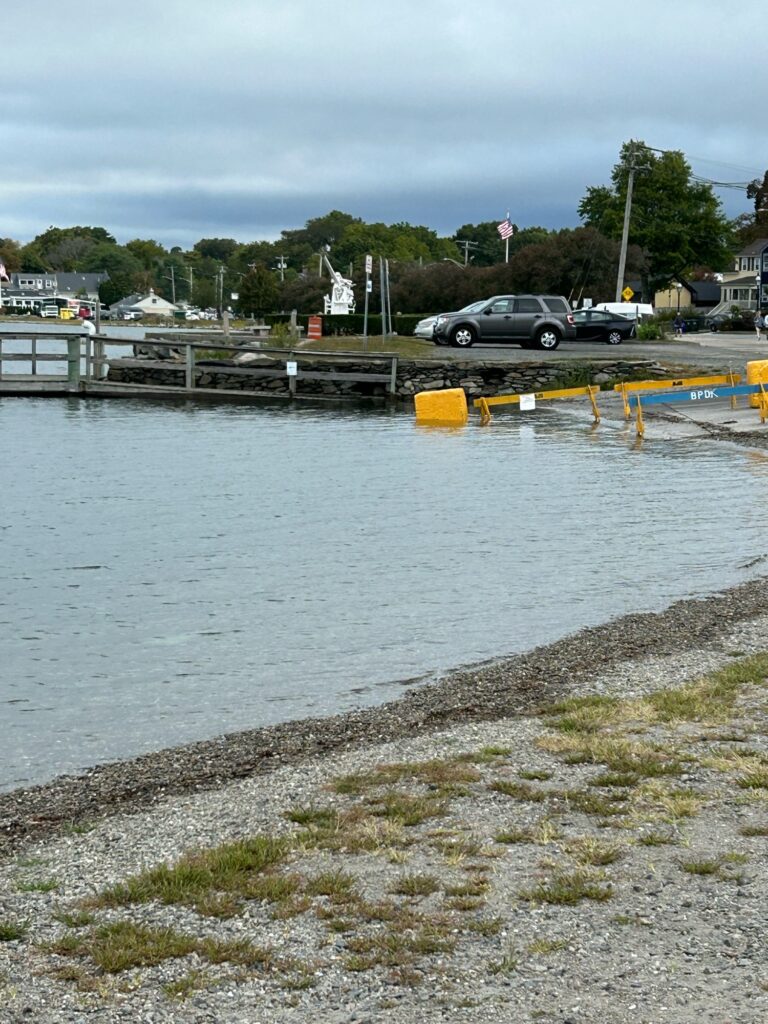 a body of water with cars parked along it (MyCoast AI)