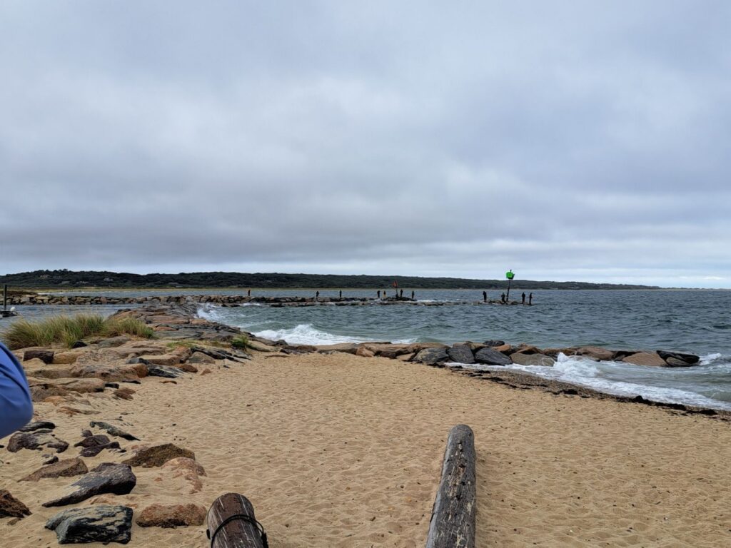 a beach with rocks and people (MyCoast AI)