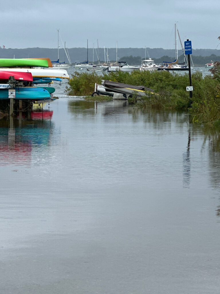 a body of water with boats and a plane in the background (MyCoast AI)