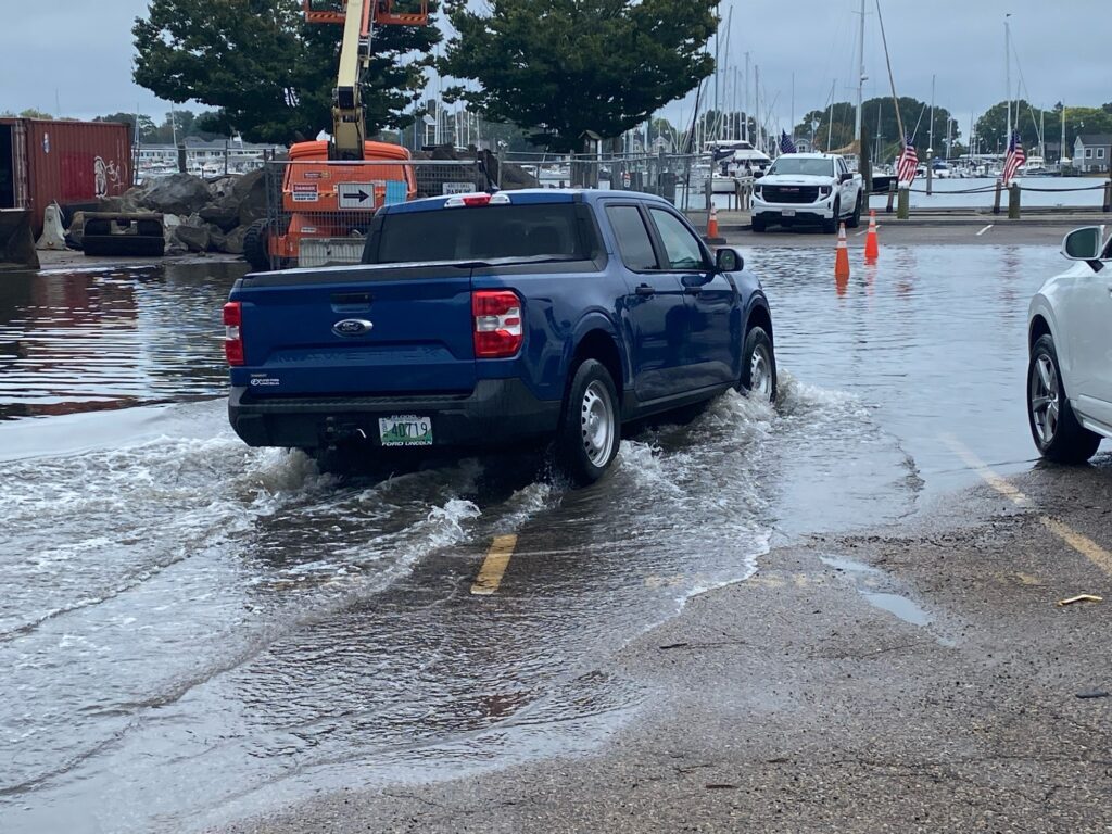 a truck driving through a flooded road (MyCoast AI)