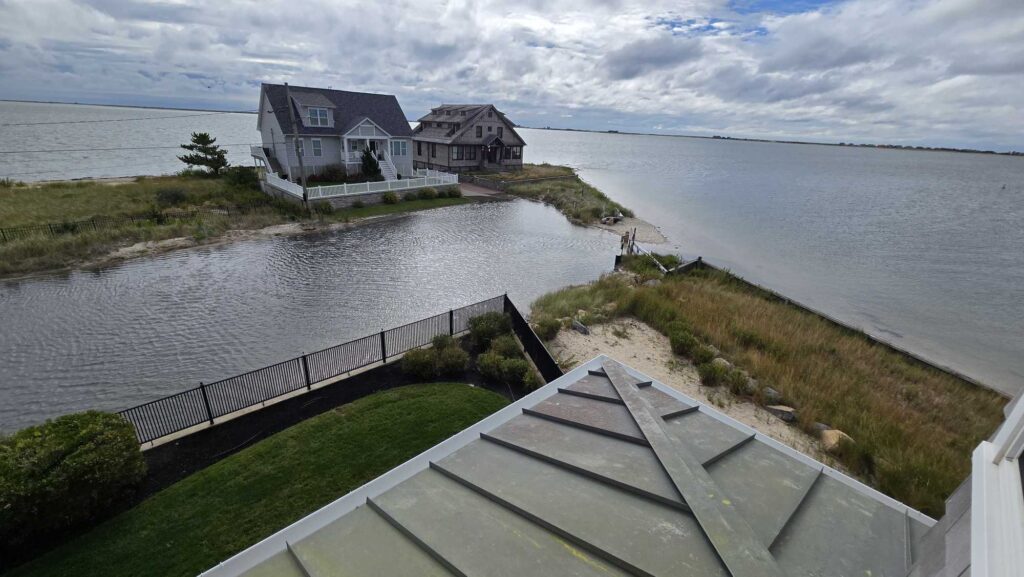 a house on a hill by the water (MyCoast AI)