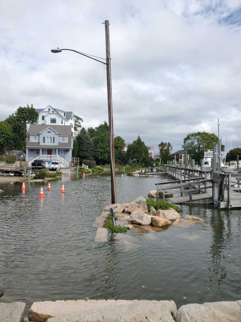 a body of water with a dock and a house in the background (MyCoast AI)