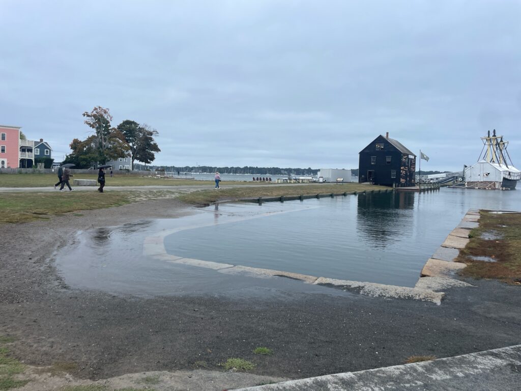 a body of water with people walking around it (MyCoast AI)