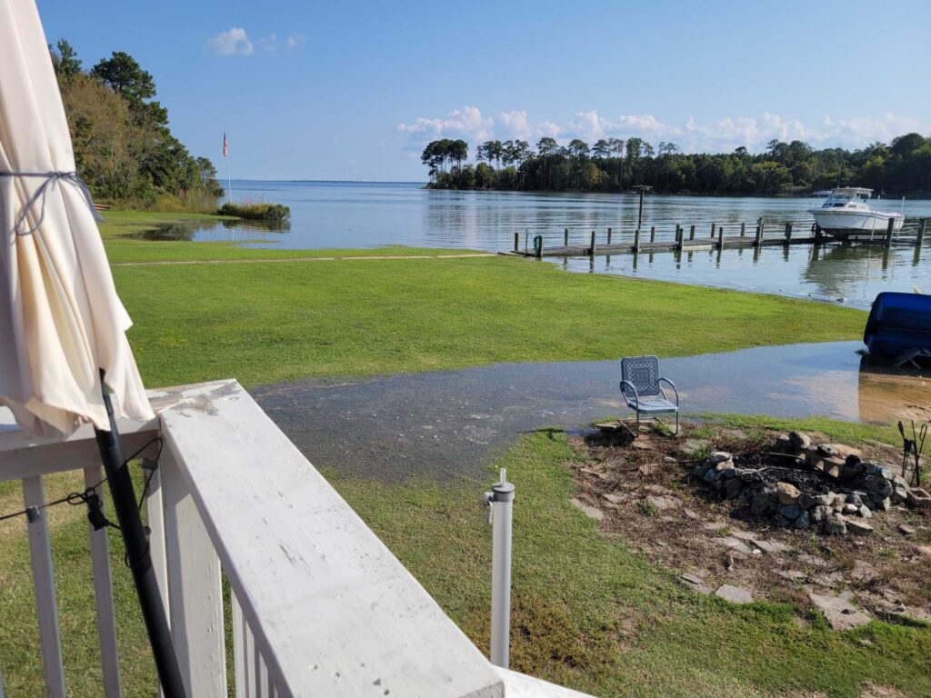 a white bench next to a body of water (MyCoast AI)