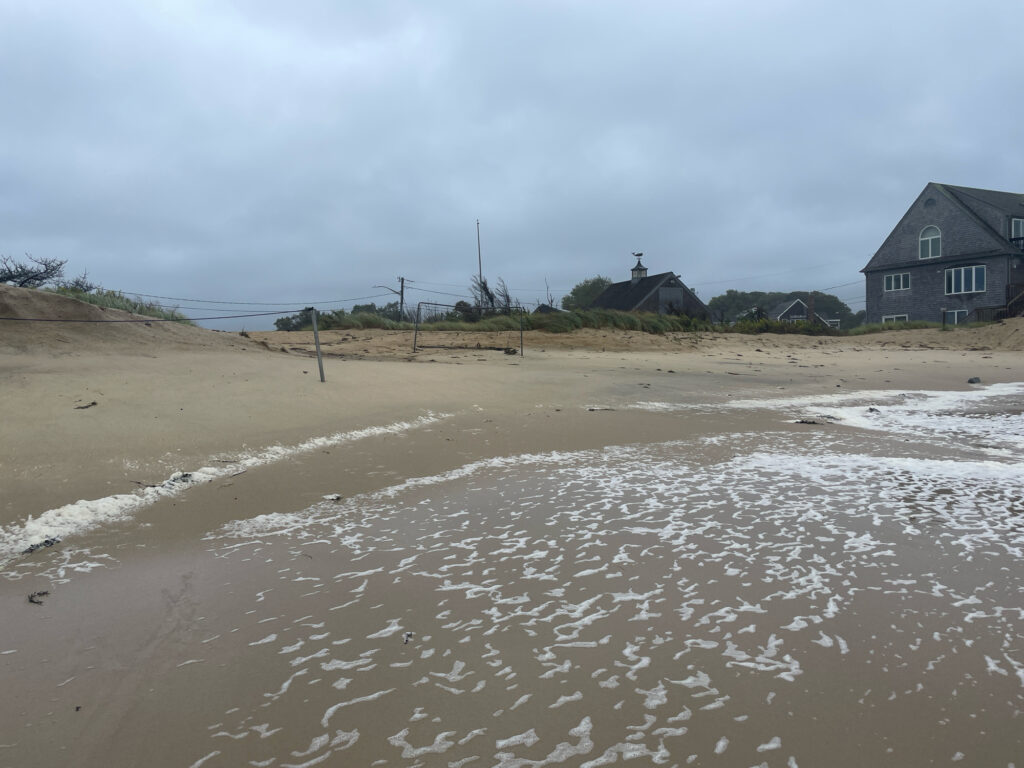 a beach with houses and water (MyCoast AI)
