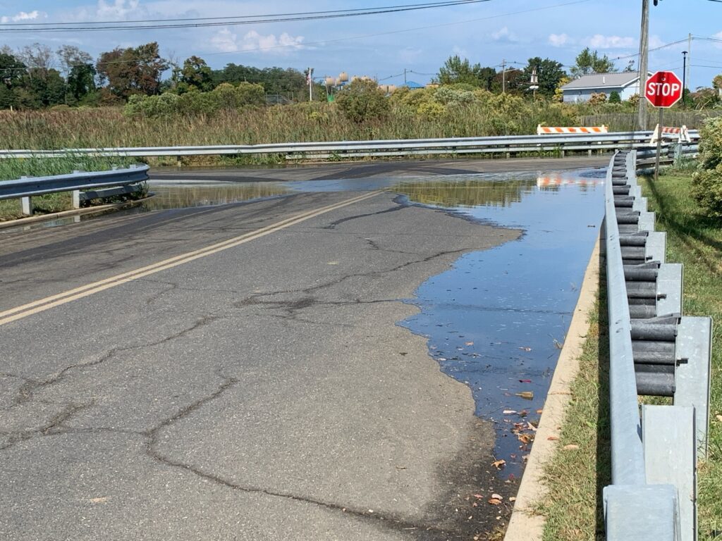 a flooded road with a stop sign (MyCoast AI)