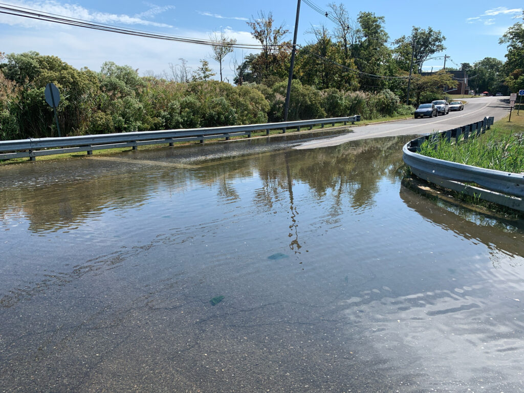 a flooded street with a boat (MyCoast AI)