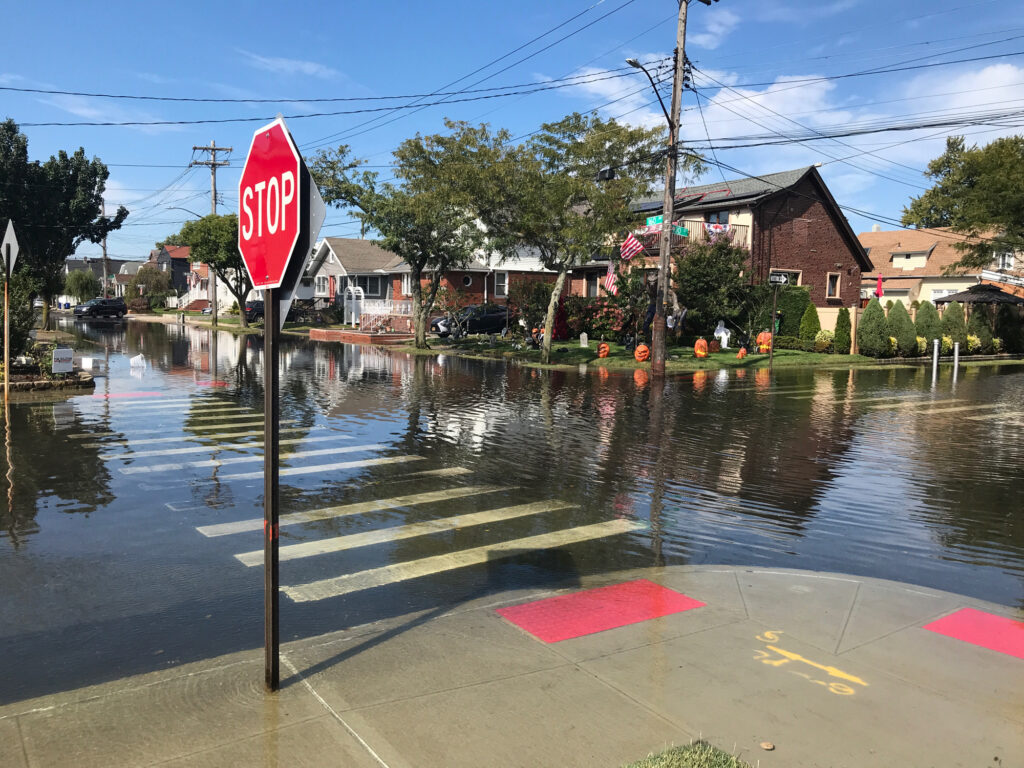 a flooded street with a stop sign (MyCoast AI)