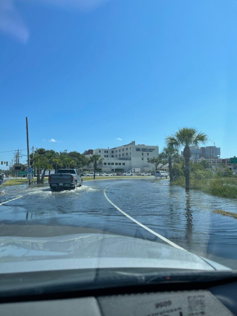 a car driving through a flooded road (MyCoast AI)