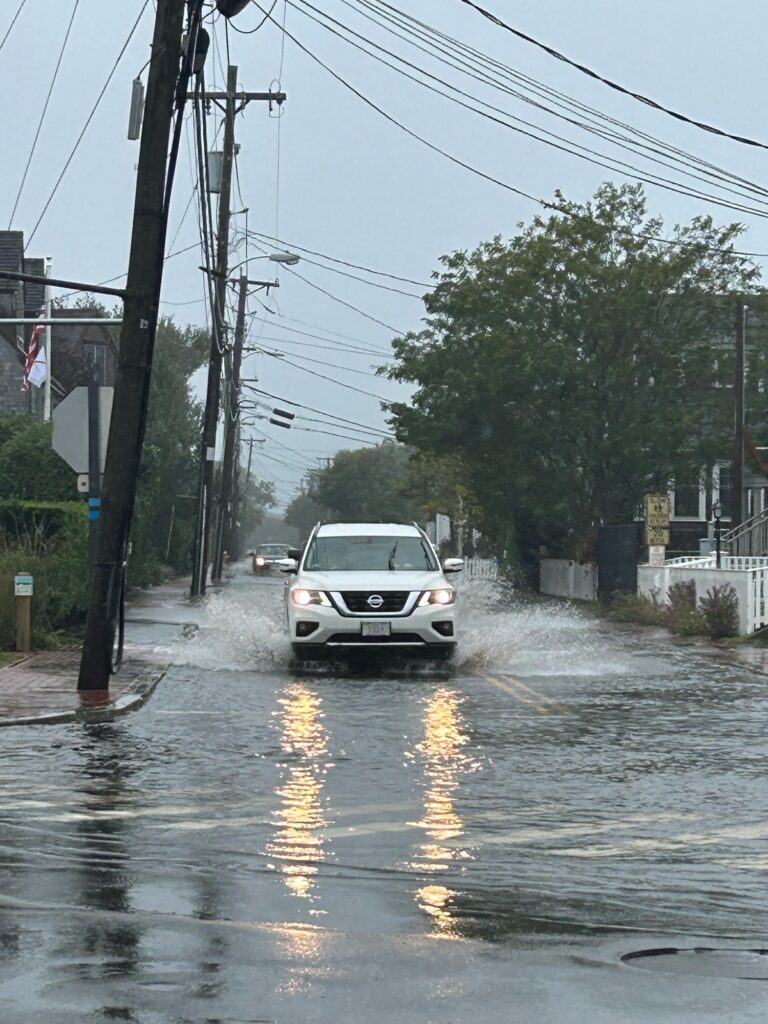 a car driving through a flooded street (MyCoast AI)