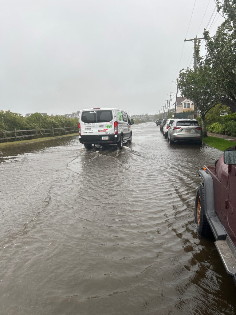 a flooded street with cars (MyCoast AI)