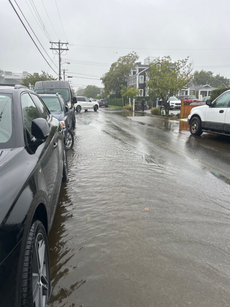 a flooded street with cars (MyCoast AI)
