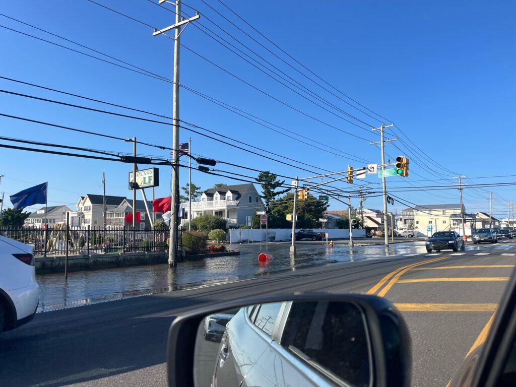 a flooded street with cars (MyCoast AI)
