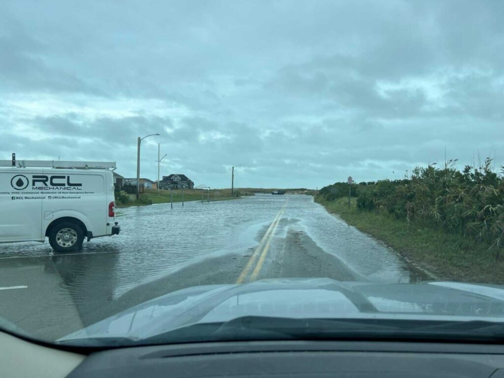 a truck driving down a wet road (MyCoast AI)