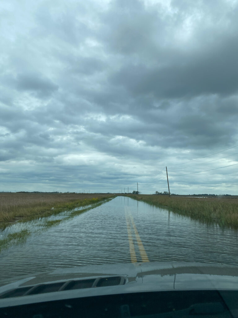 a car driving on a flooded road (MyCoast AI)