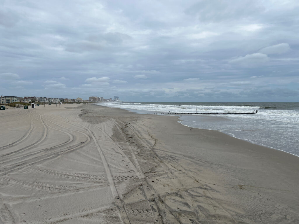 a beach with waves crashing on it (MyCoast AI)