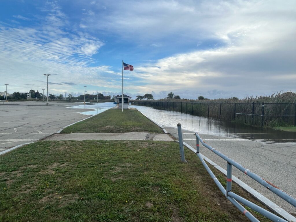 a road with a railing and a flag on it (MyCoast AI)