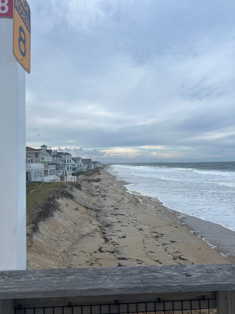 a beach with a building on the shore (MyCoast AI)