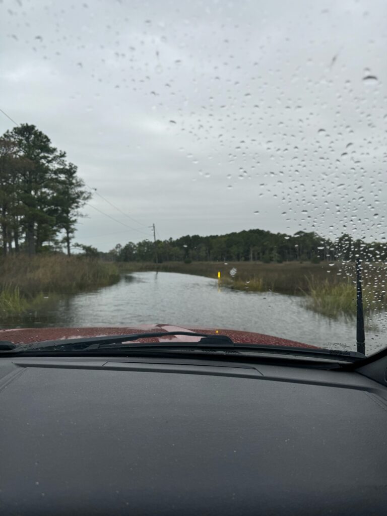 a car driving through a flooded road (MyCoast AI)
