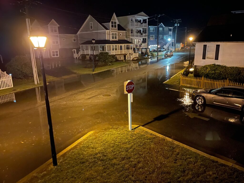 a street with cars parked on the side of it (MyCoast AI)