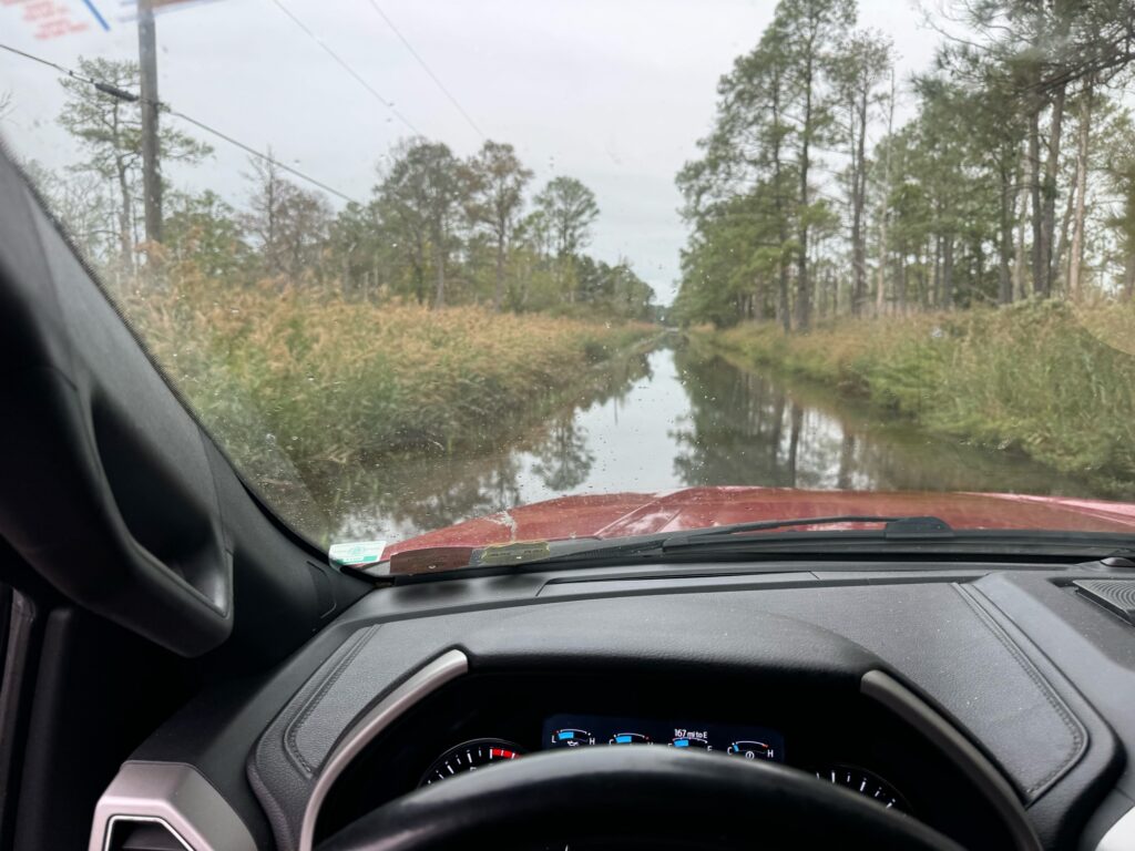 a car driving on a flooded road (MyCoast AI)