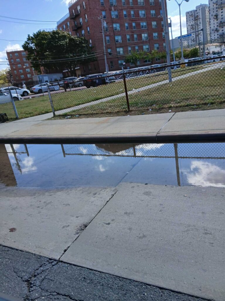 a fenced off area with a building in the background (MyCoast AI)