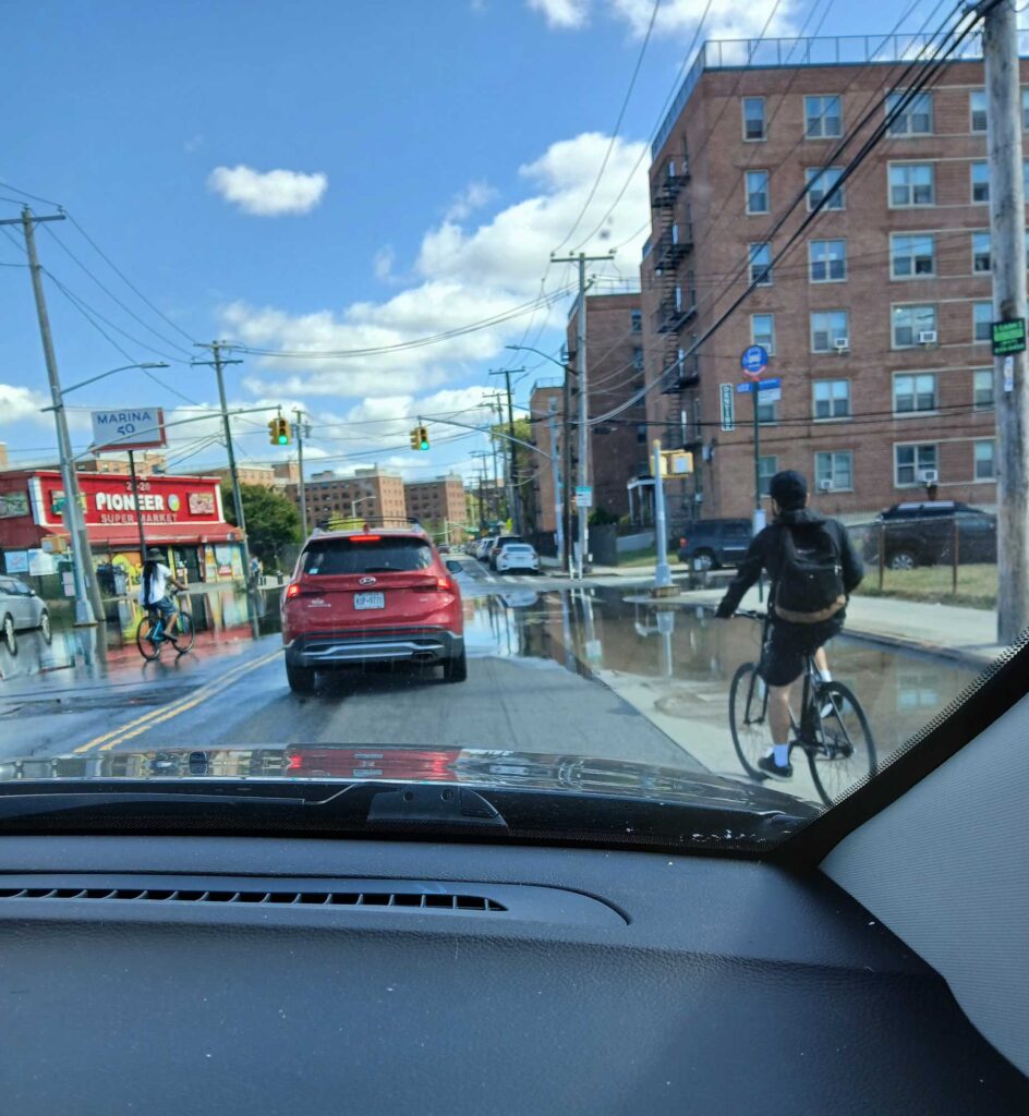 a person riding a bicycle on a city street (MyCoast AI)