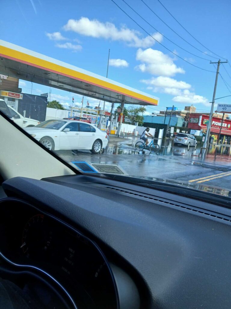 a car driving on a wet road (MyCoast AI)