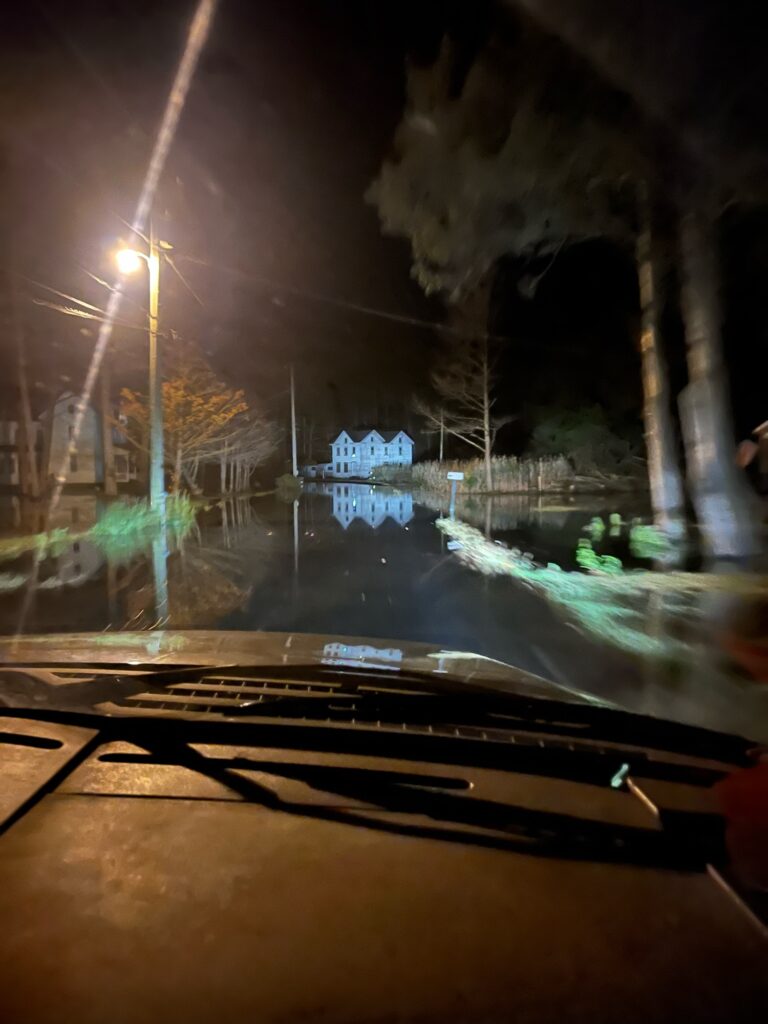 a car driving on a road at night (MyCoast AI)