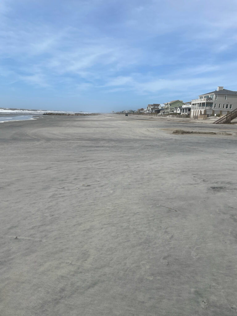 a beach with buildings on the side (MyCoast AI)