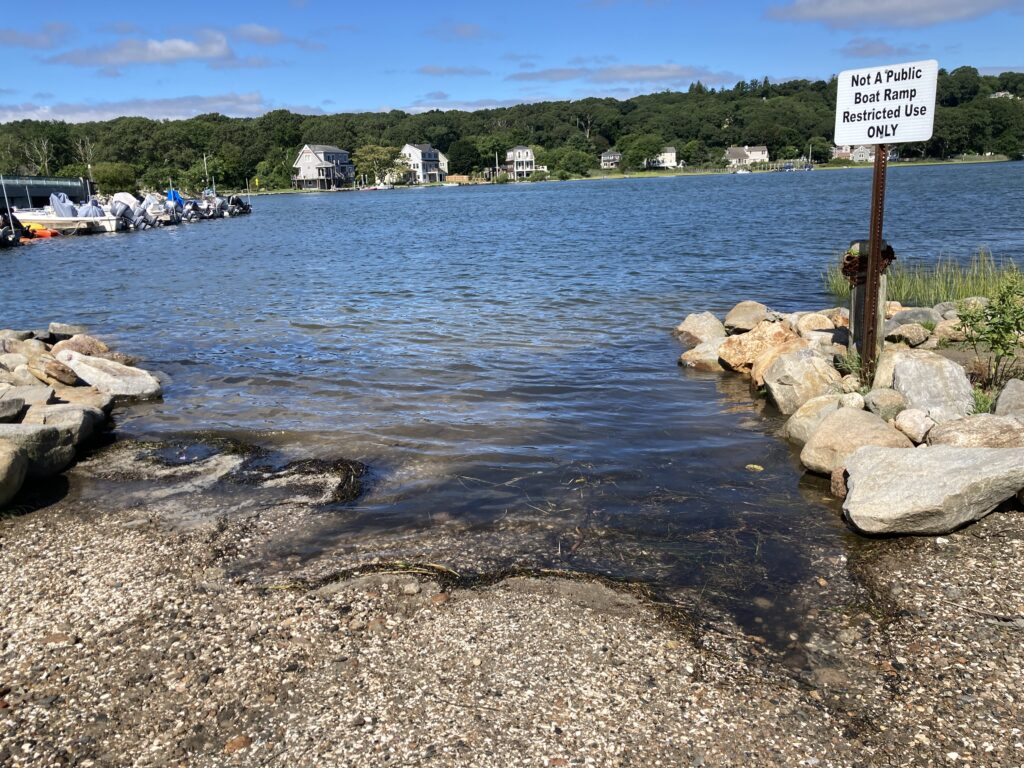 a sign on a rocky shore (MyCoast AI)
