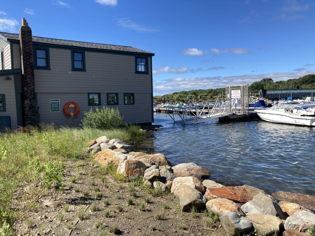 a building next to a body of water (MyCoast AI)