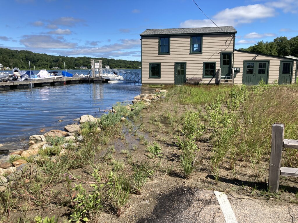 a building next to a body of water (MyCoast AI)