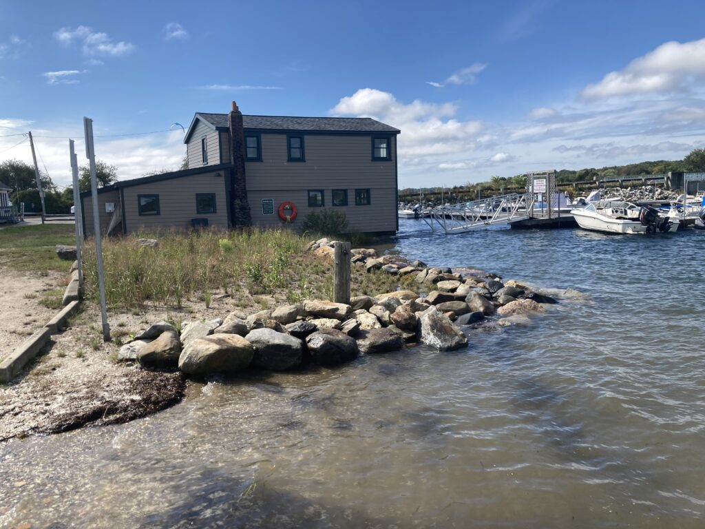 a building next to a body of water (MyCoast AI)