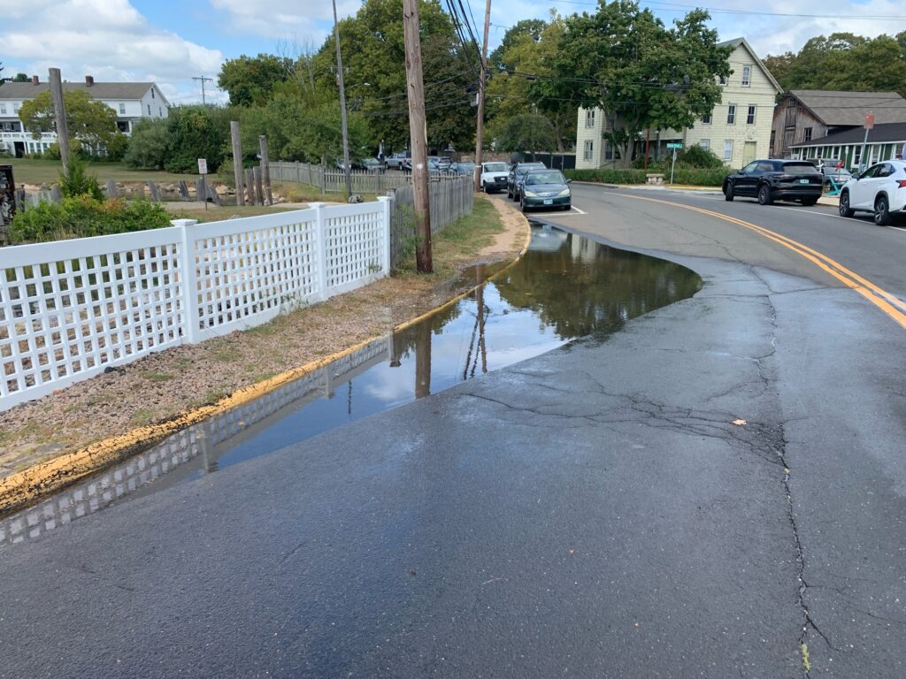 a flooded street with cars (MyCoast AI)
