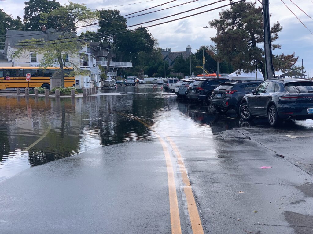 a flooded street with cars and buses (MyCoast AI)