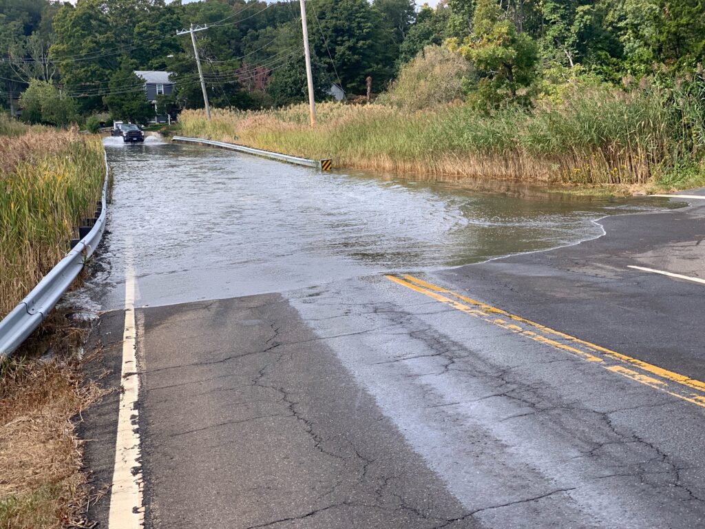 a flooded road with cars (MyCoast AI)