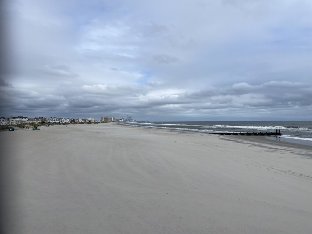 a beach with waves crashing on it (MyCoast AI)