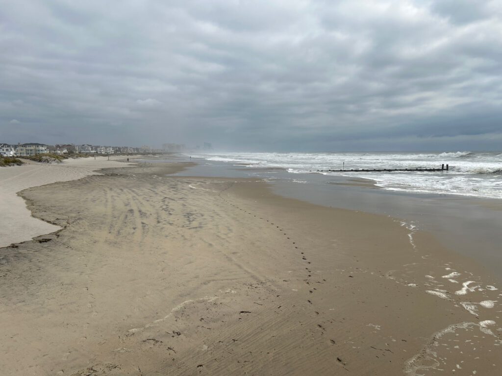 a beach with waves crashing on it (MyCoast AI)