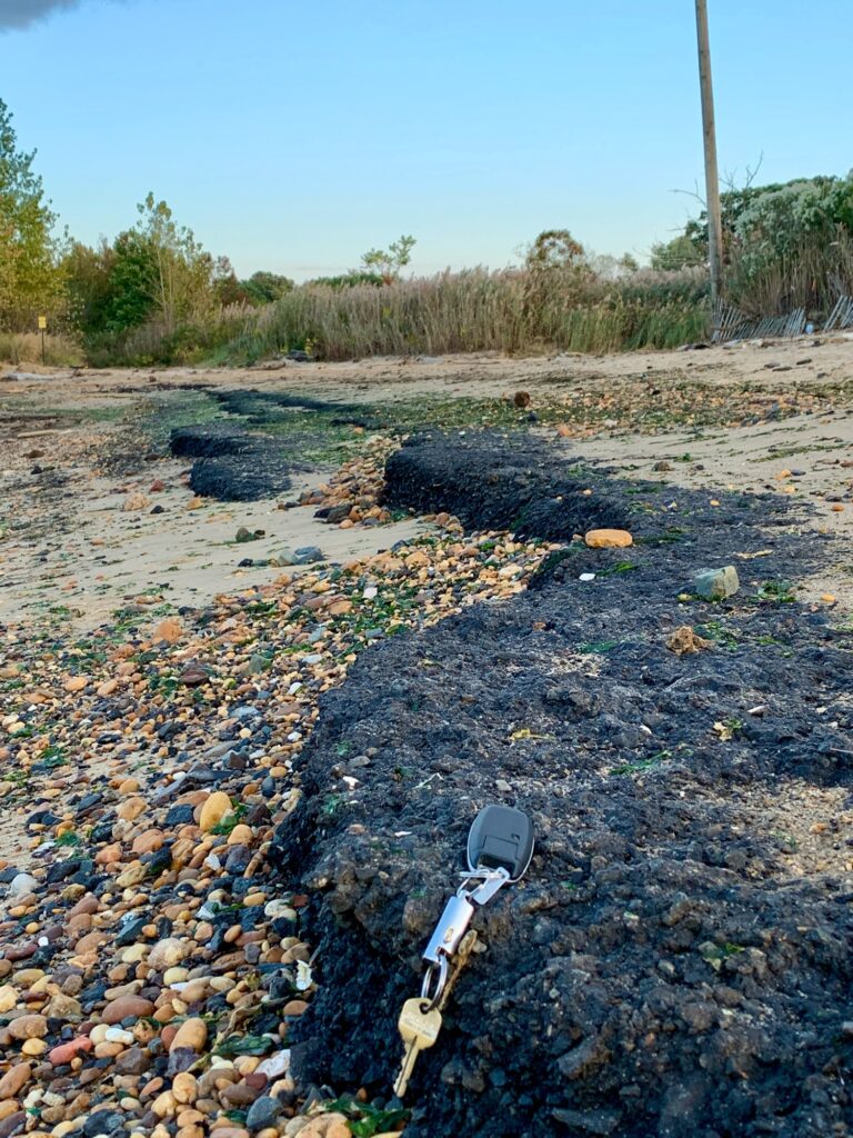a broken phone on the ground (MyCoast AI)