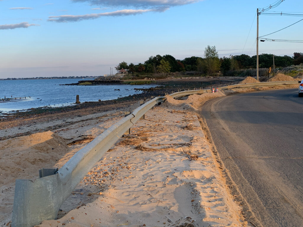 a road next to a body of water (MyCoast AI)